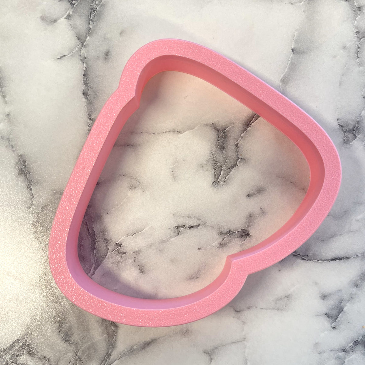 Pink heart-shaped glittery cookie cutter from candy corn cluster flour box club for baking and decorating cookies