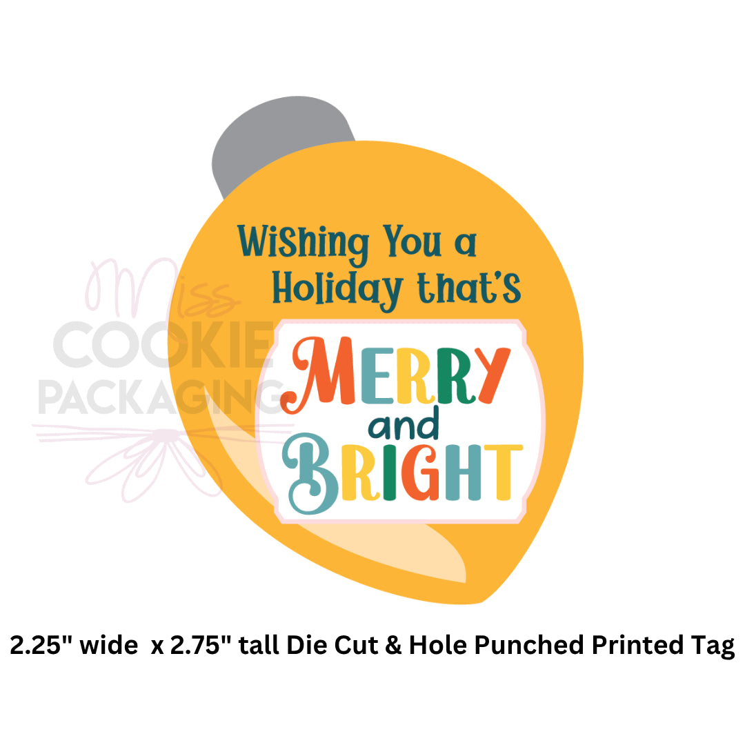 Decorative printed tag with 'Merry and Bright' text on a yellow background