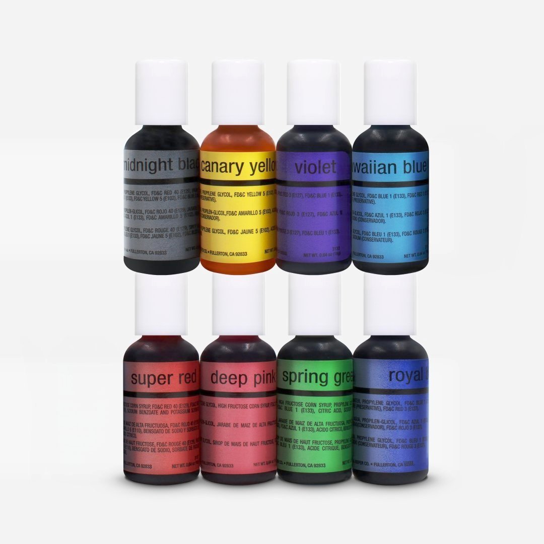 Set of eight colorful chefmaster airbrush food coloring bottles with white caps and bold sans serif labels