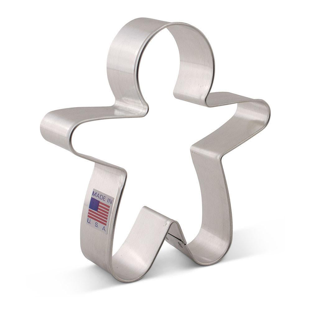 A shiny metallic gingerbread man cookie cutter with a smooth reflective surface and made in USA label